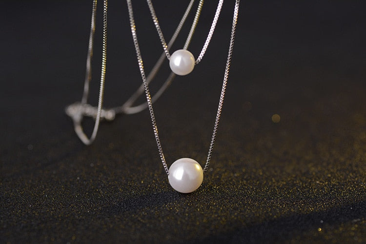 silver necklace with pearls	
